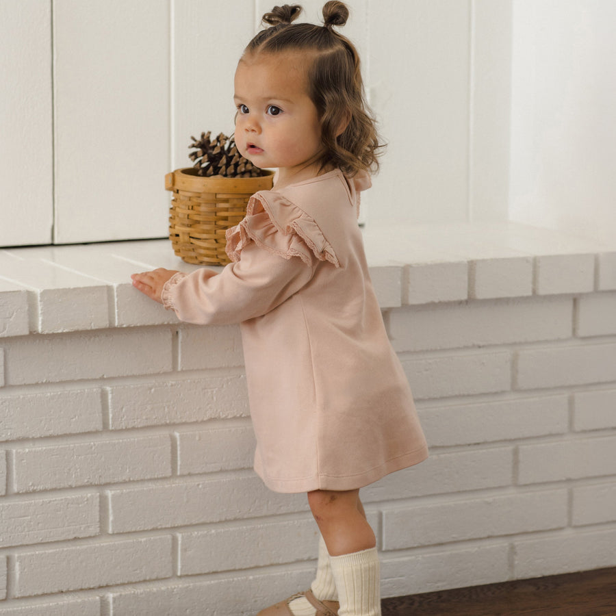 Toddler in a dusty rose Quincy Mae dress