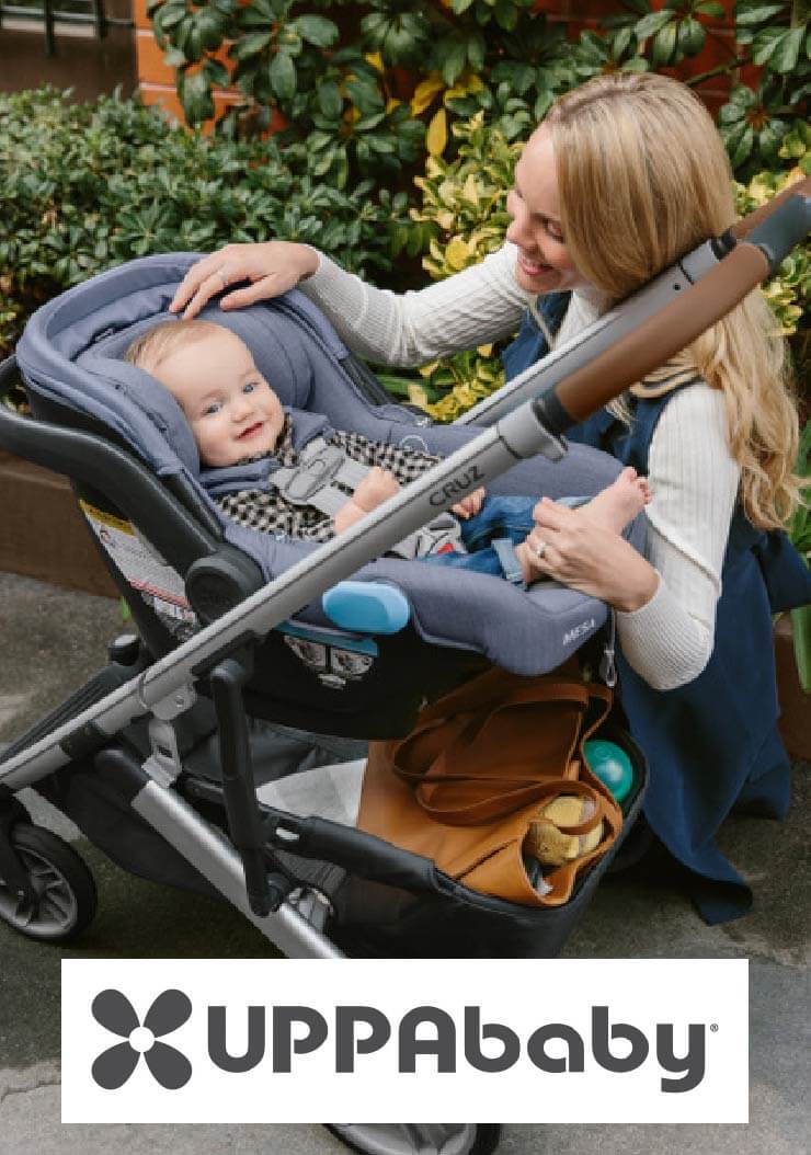 Mom checking on her baby in an UPPAbaby stroller